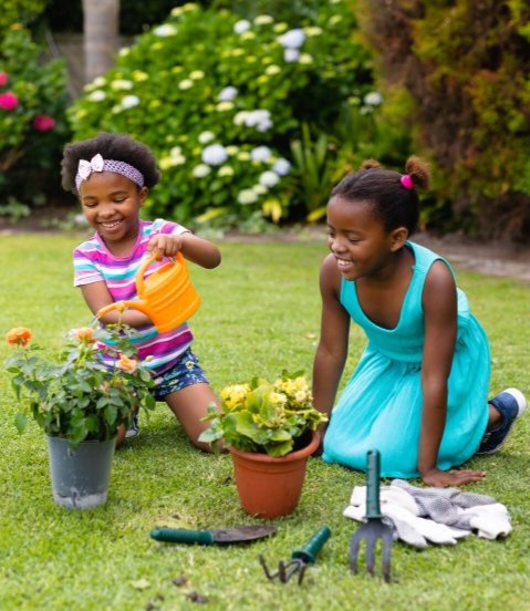 Students using donated equipment in a school garden